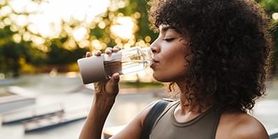 Woman drinking water from glass