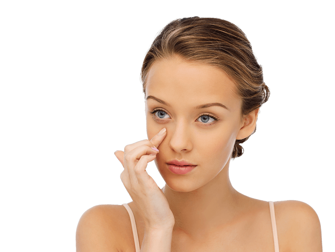 Picture of a young woman smoothing the skin below her eye