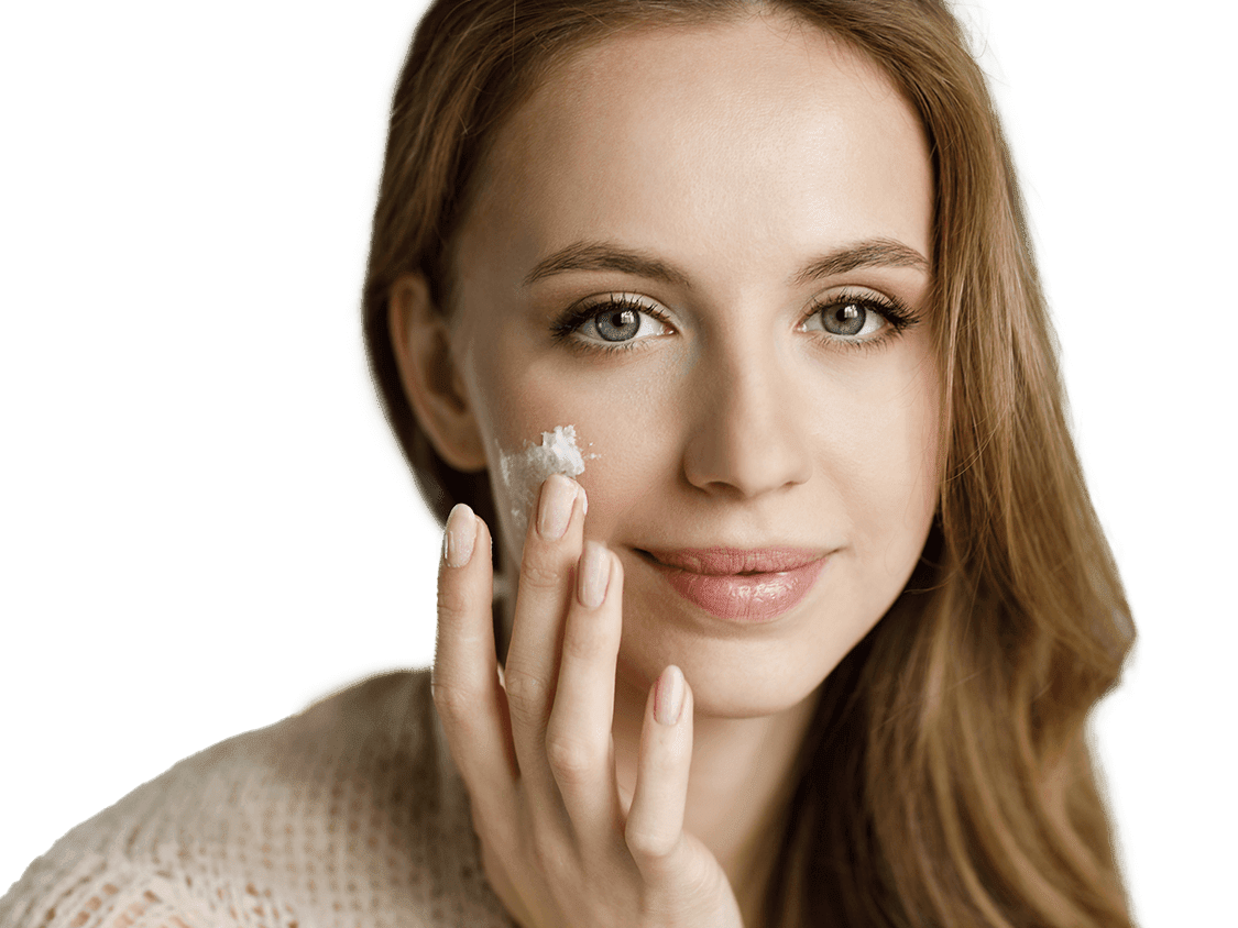 Picture of a woman rubbing lotion on her face