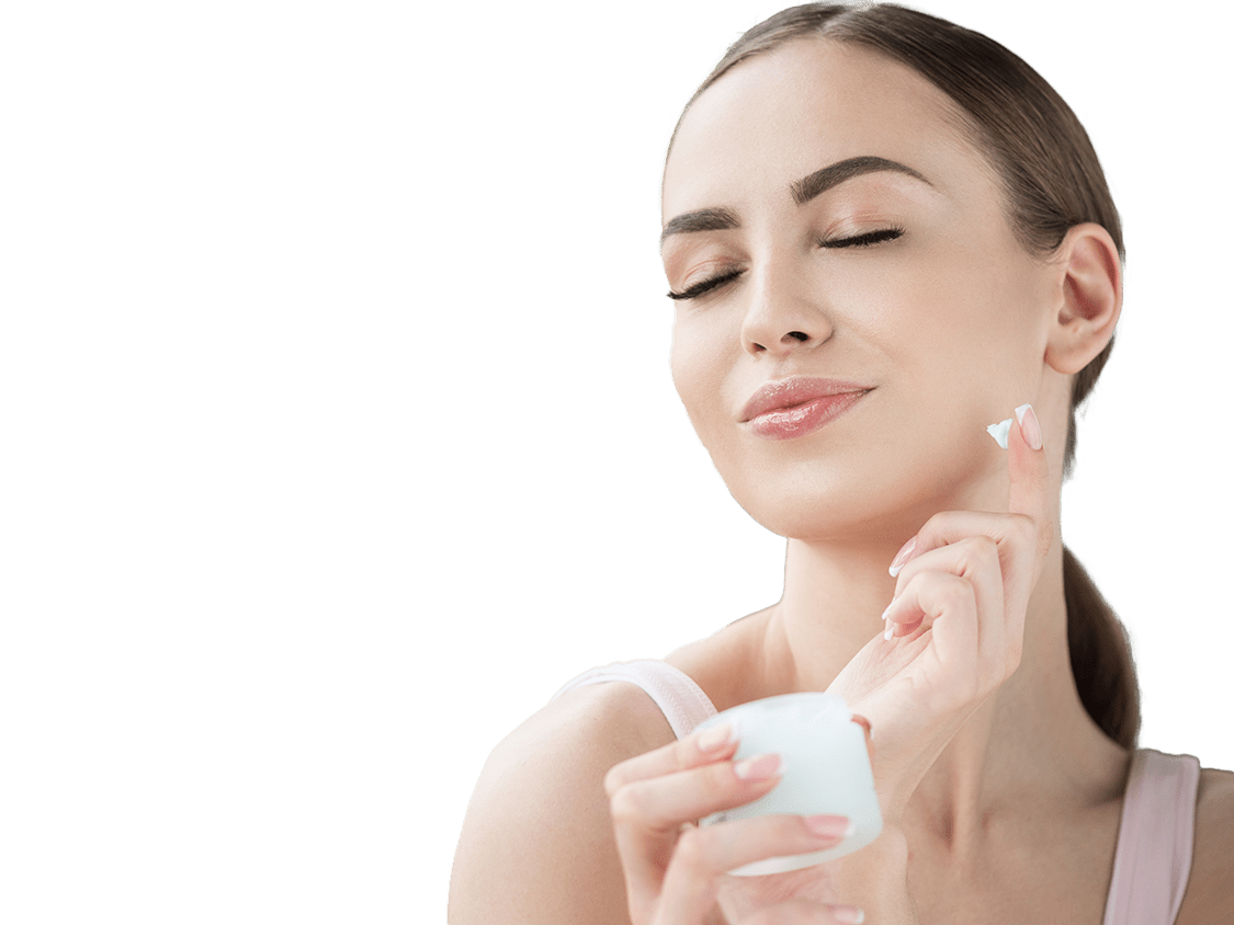 Woman applying Lotion to her face