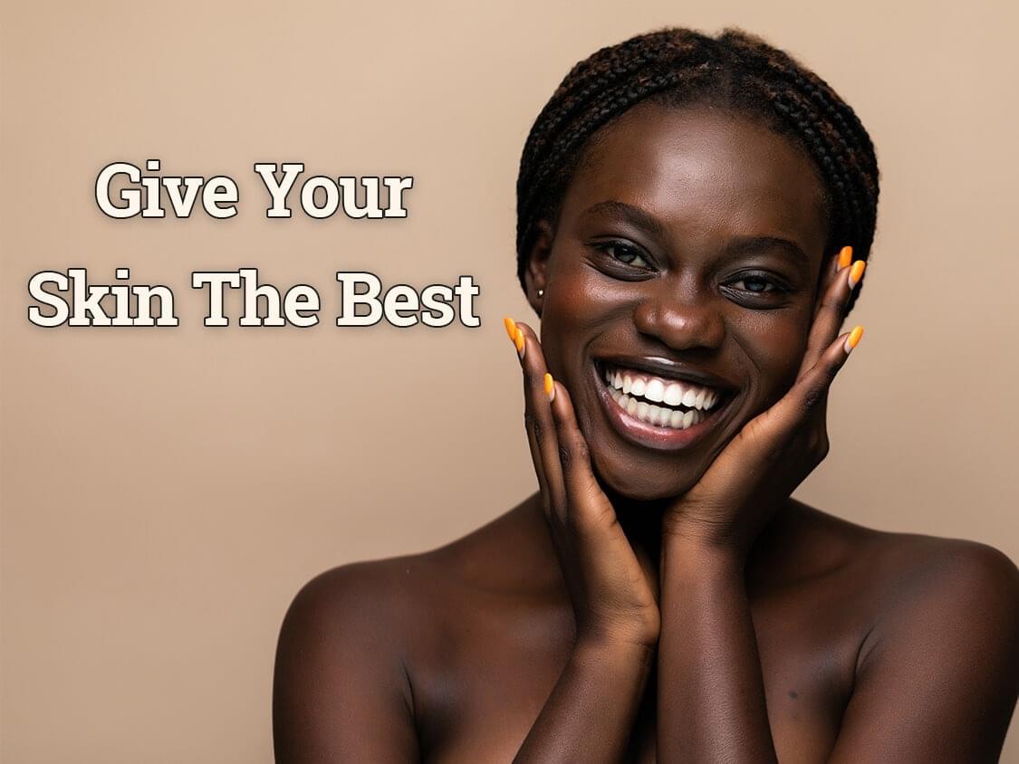 Woman with big smile that reads "Give Your Skin The Best"