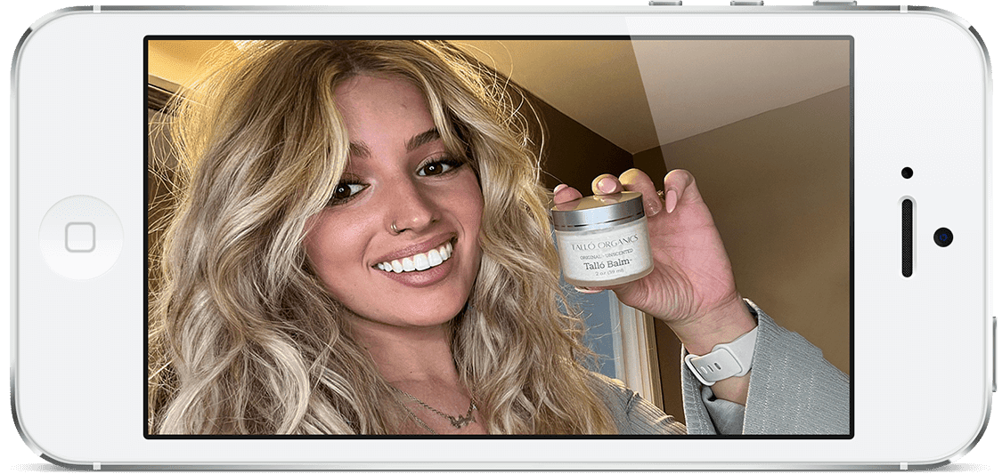 Emily Navarro holding a jar of Tallo Balm