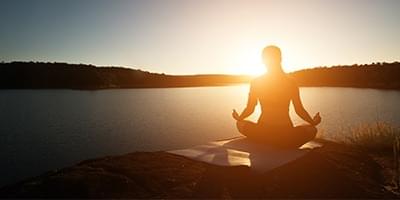 Woman practicing yoga outside